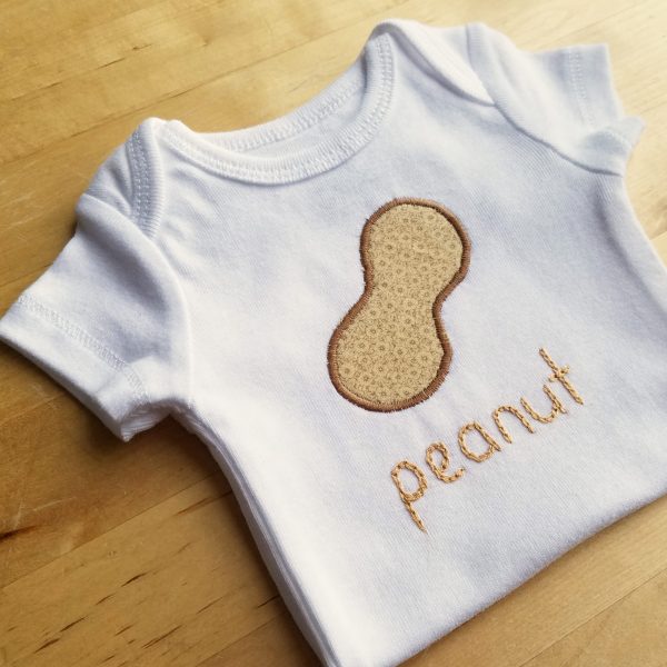 peanut onesie on table