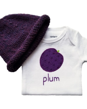 plum bodysuit and hand knit hat