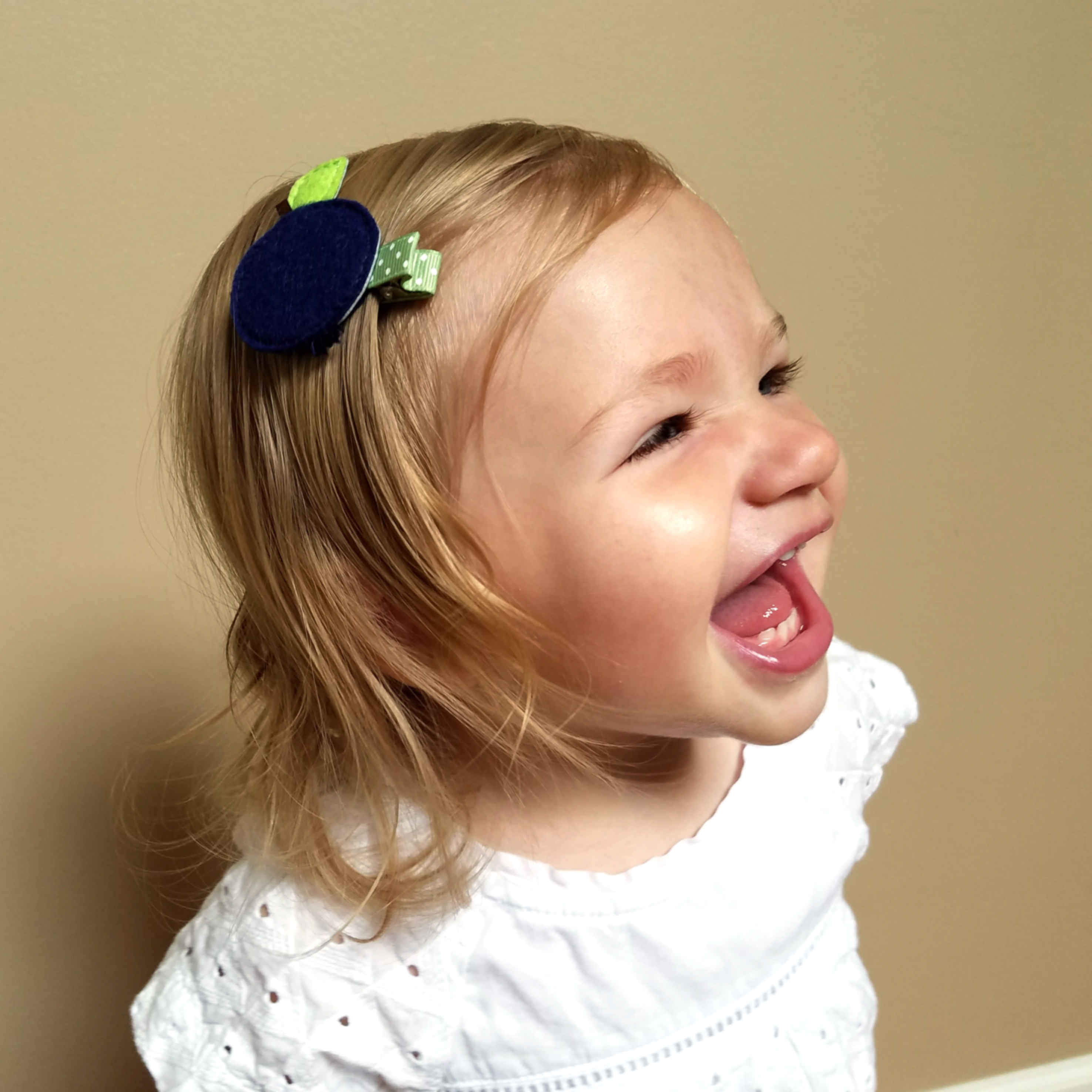 toddler girl wearing blueberry hair clip