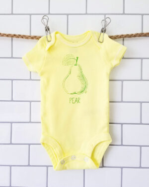 hand dyed, screen printed pear bodysuit hanging up