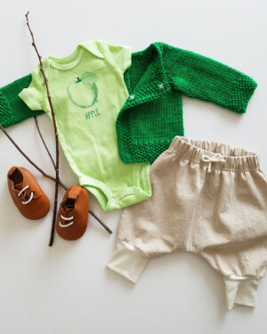 green apple bodysuit flatlay with cotton sweater and linen harem pants