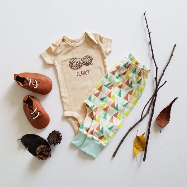 hand dyed, screen printed peanut bodysuit flatlay with harems