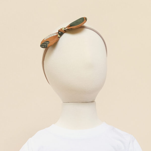 zoe baby headband avocado on model