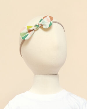 zoe baby headband geometric triangle on model